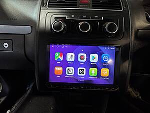 Android car stereo with touchscreen display for CarPlay integration and multimedia control.
