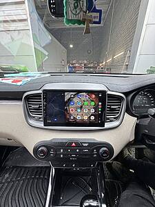 Android car radio with CarPlay system installed in a vehicle dashboard.