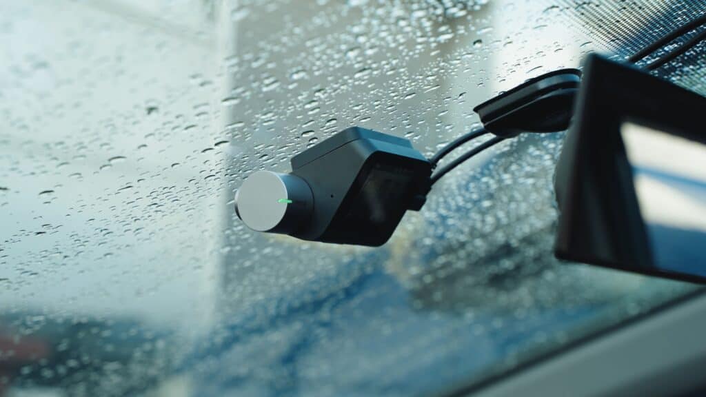 Rain sensor device on a car windscreen, suitable for auto rain detection systems.