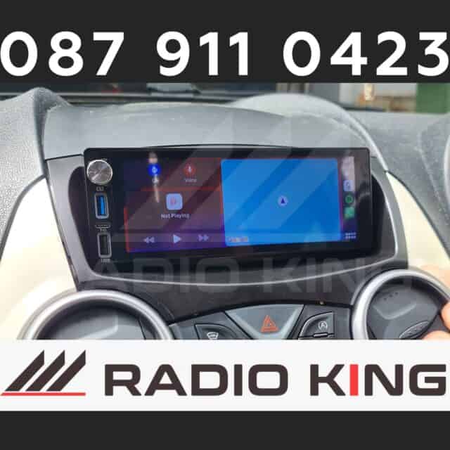 Android car radio with CarPlay system installed in vehicle dashboard.