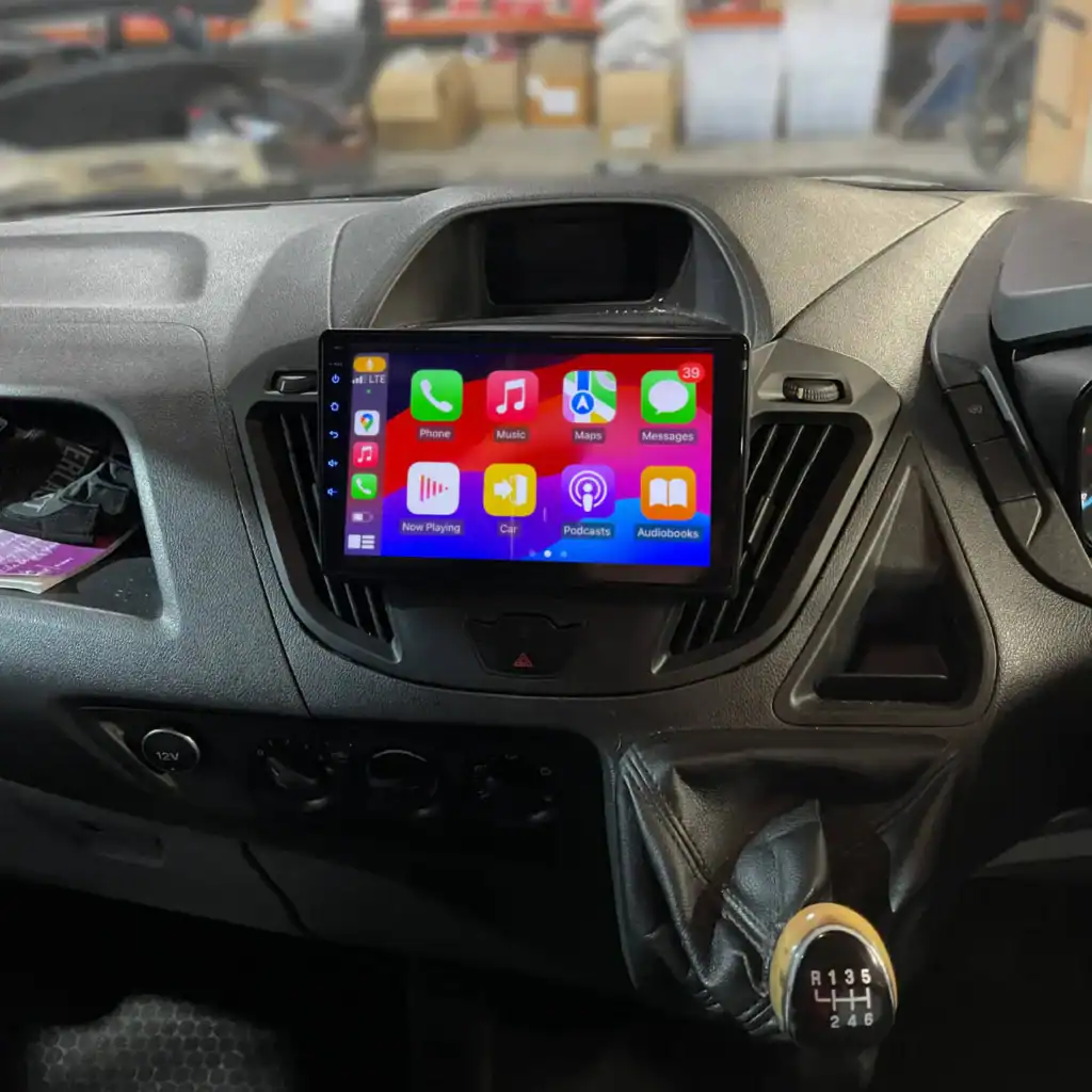 Android car radio with Apple CarPlay system installed in vehicle dashboard.