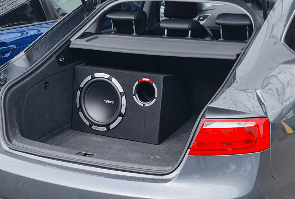 High-quality car subwoofer system installed in the trunk of a silver vehicle.