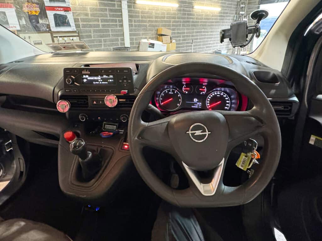 Android car stereo system with CarPlay compatibility installed in a van dashboard.