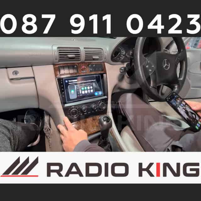 087 911 0423, car stereo illustrated with Android CarPlay system in a vehicle interior, contacts for Radio King Ireland.