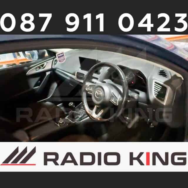 087 911 0423, Car interior with aftermarket Android car radio system and CarPlay compatible display, enhancing dashboard multimedia and connectivity features, suitable for modern vehicles, offered by Radio King Ireland.