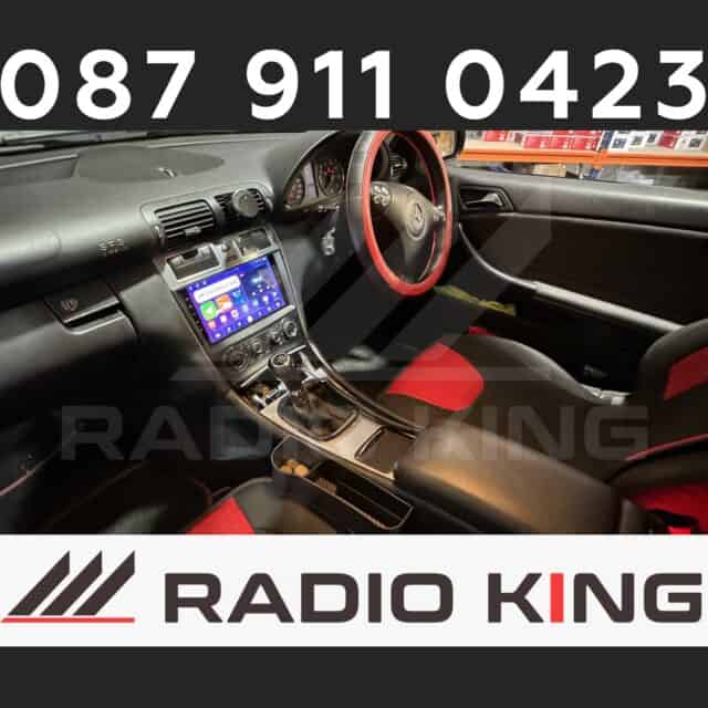 087 911 0423 car radio system with CarPlay and Android Auto installed inside a vehicle.