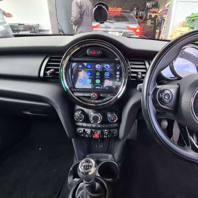 Android car stereo system with touchscreen display inside a vehicle.