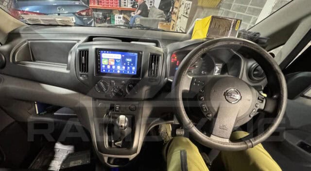 Android car stereo system with CarPlay in Nissan vehicle.