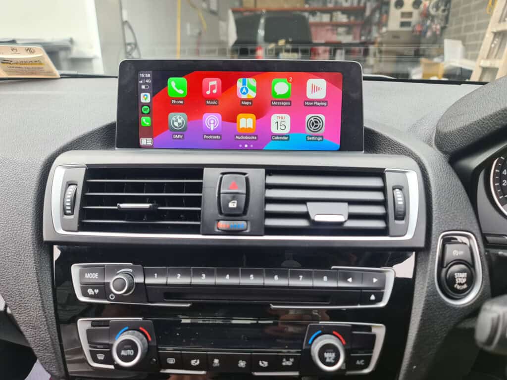 Android car stereo system with Apple CarPlay display in vehicle dashboard, enabling seamless smartphone integration.