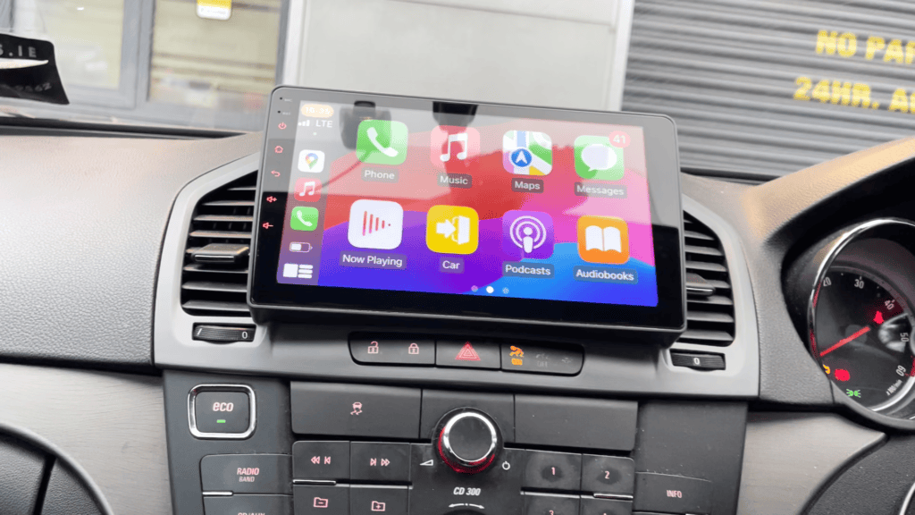 Android car head unit with CarPlay system installed in vehicle dashboard.