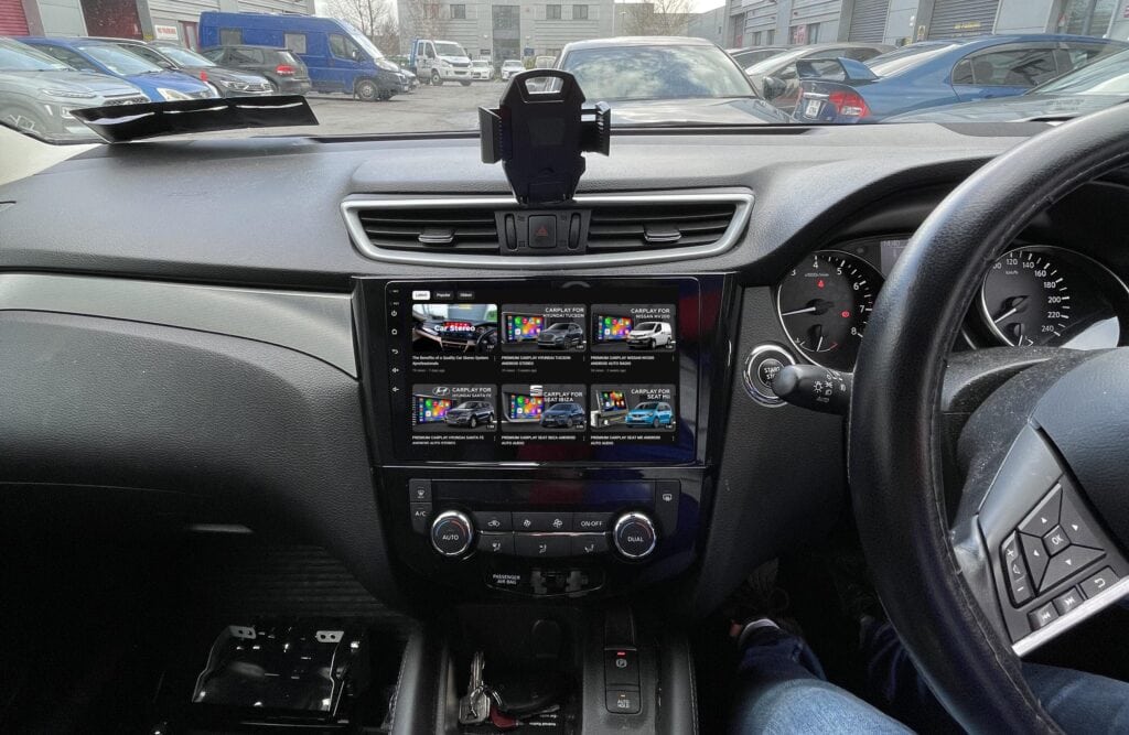 Android car stereo system with touchscreen display installed in a vehicle dashboard.