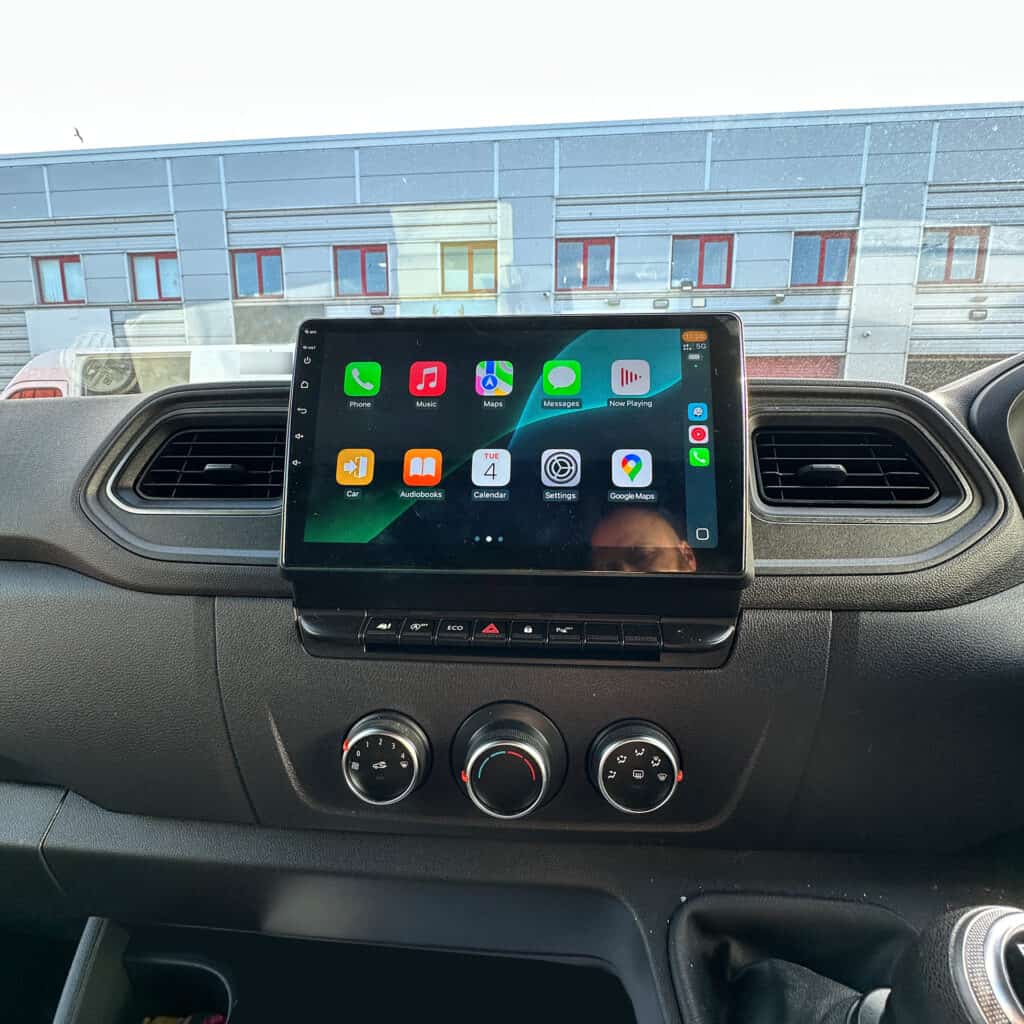 Android car radio touchscreen with CarPlay system installed in vehicle dashboard.