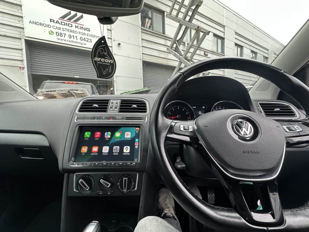 Android car stereo system with CarPlay, installed in a Volkswagen vehicle.