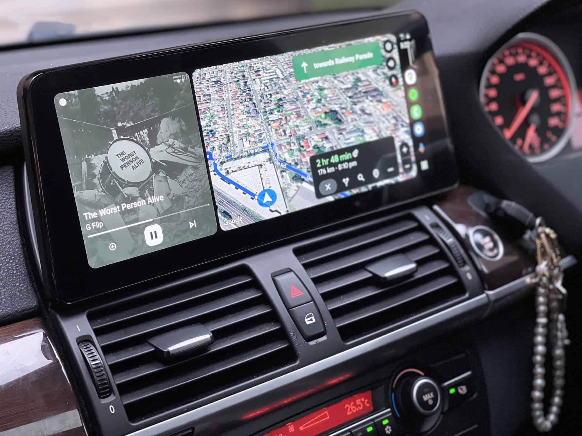 Android car stereo system with GPS navigation and music playback.
